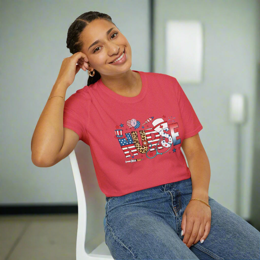 Blue unisex t-shirt featuring the word "NURSE" with patriotic stars and stripes, medical symbols, and festive red, white, and blue designs