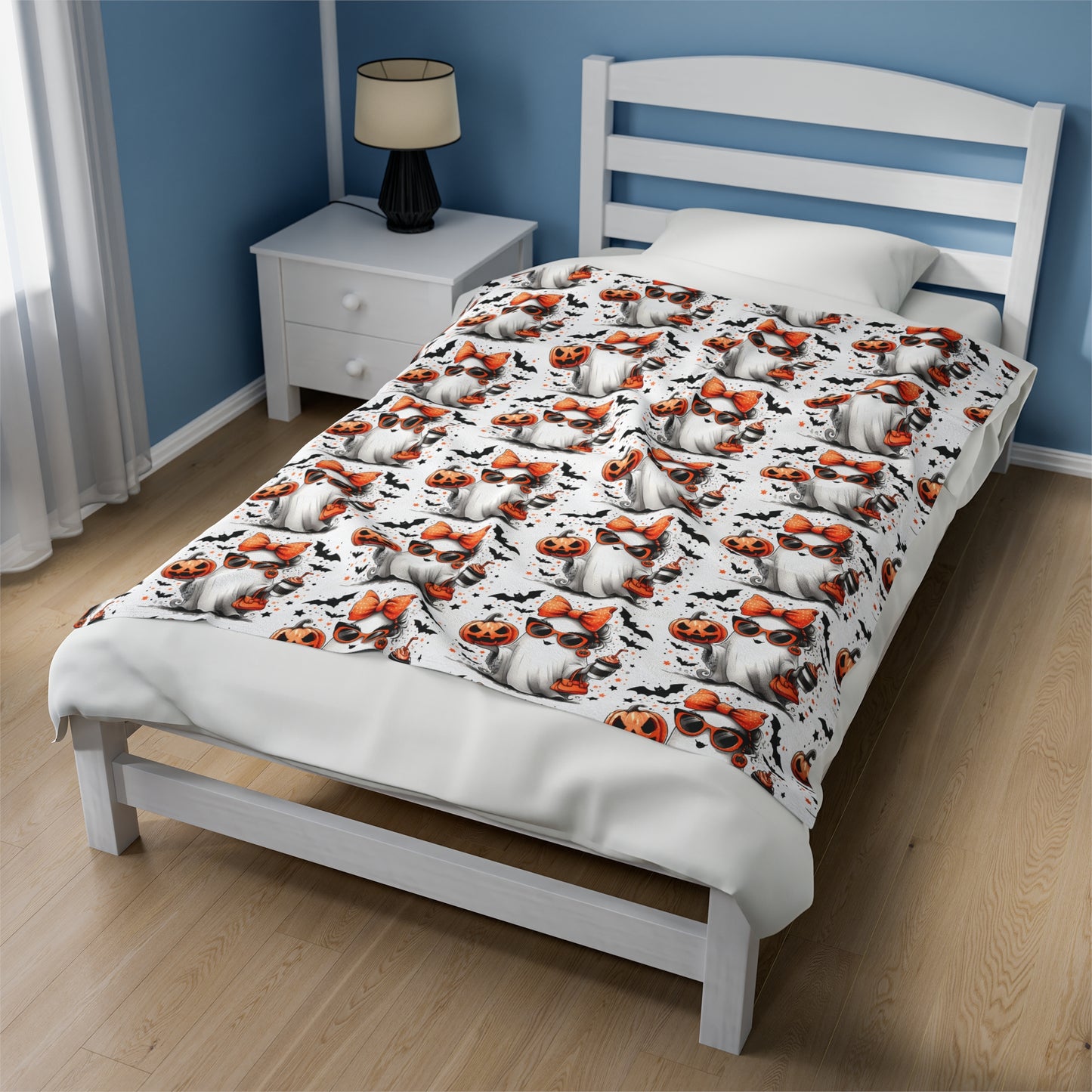 White blanket with a girl ghost holding an orange drink.