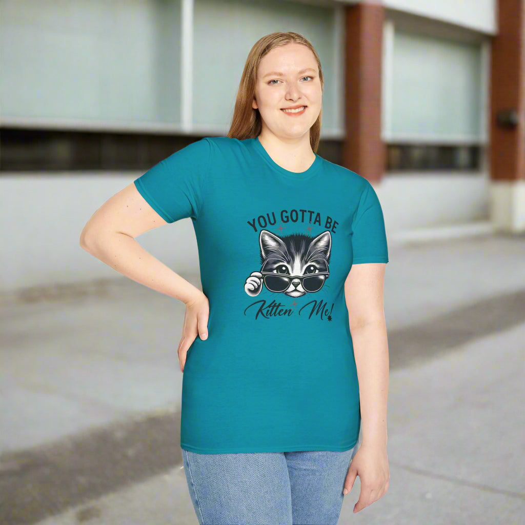 Stylish black and white illustration of a cool cat wearing sunglasses with text reading "YOU GOTTA BE Kitten Me!" on a unisex softstyle t-shirt for cat lovers
