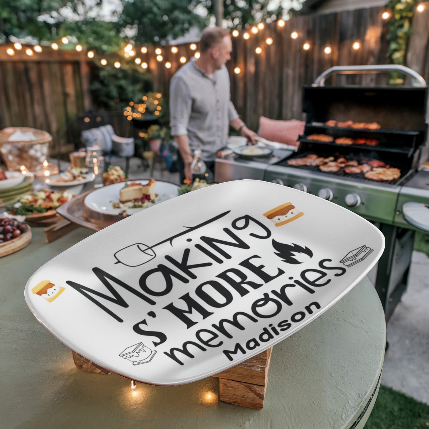 Personalized “Making S’More Memories” platter with cute s'mores graphics and the name Madison, displayed in a modern kitchen. A custom 10x14 serving dish perfect for family meals, microwave safe, dishwasher safe, and made in the USA.