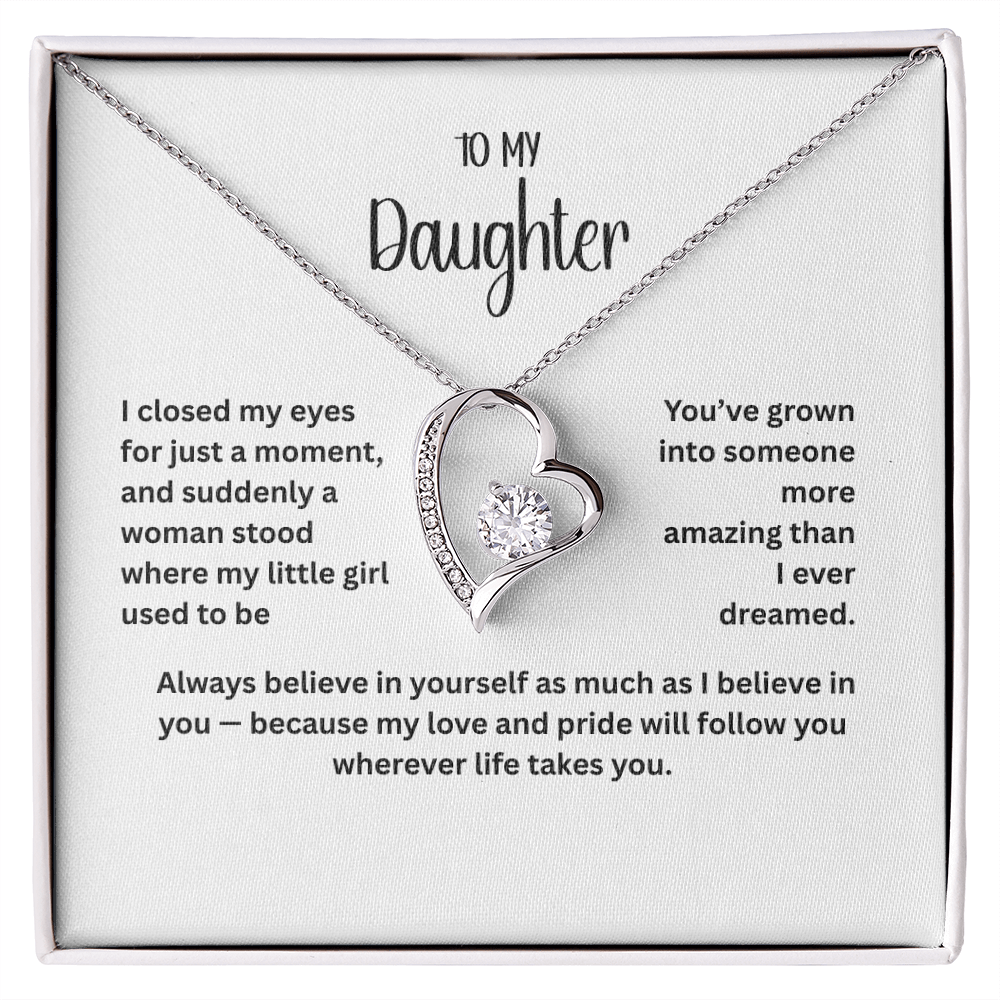 “To My Daughter heart pendant necklace with sparkling cubic zirconia stone and heartfelt message card in gift box – available in 14k white gold or 18k yellow gold finish.”