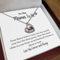 Rose gold Baby Feet Heart Necklace with cubic zirconia on a sterling silver heart frame, displayed on a keepsake card for new moms – perfect gift for baby showers and pregnancy announcements.