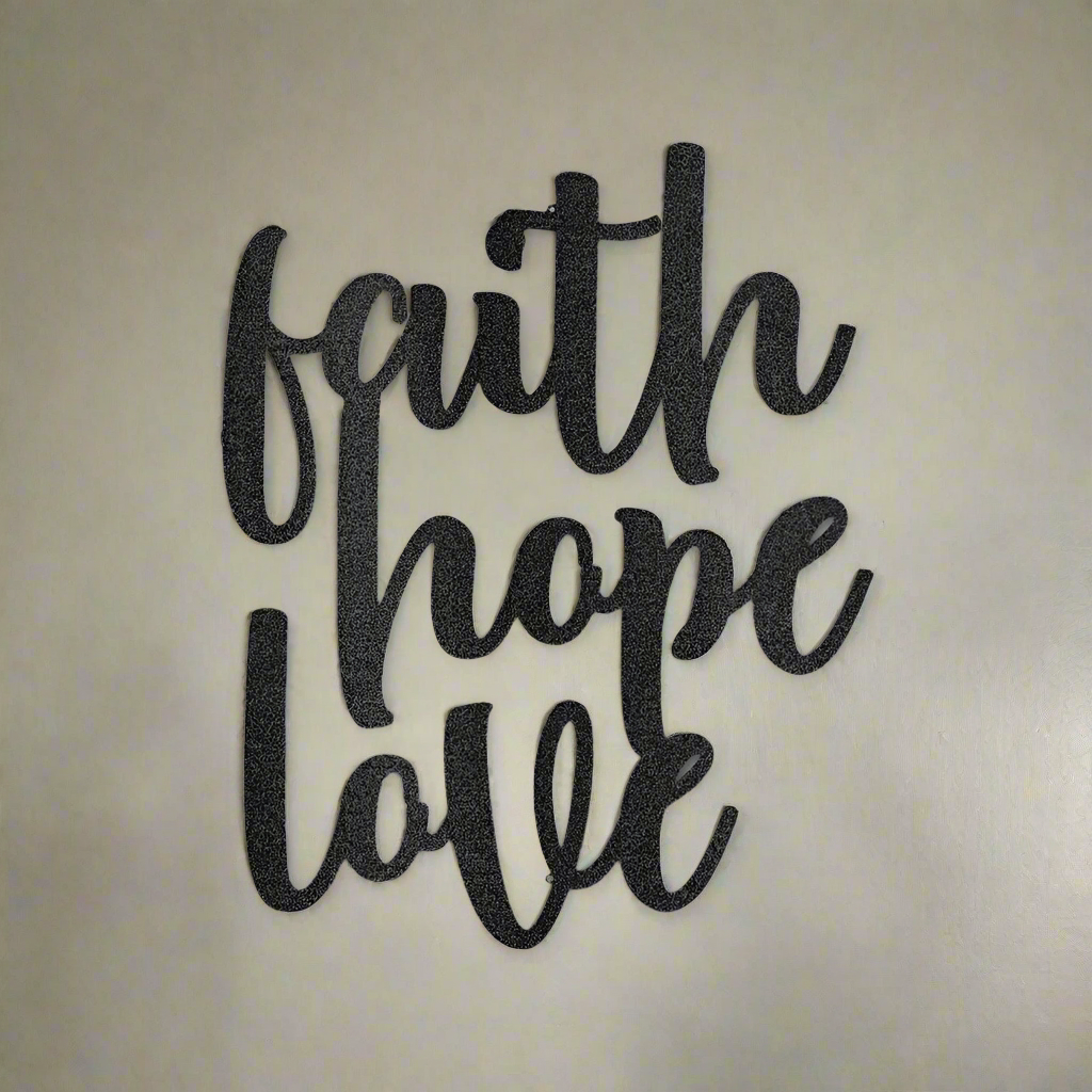 Black metal wall art featuring the words “faith hope love” in elegant script lettering, crafted from powder-coated steel for indoor or outdoor Christian home décor.