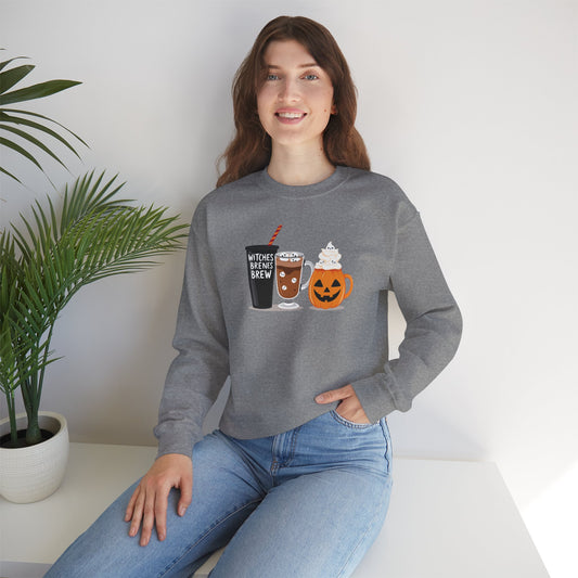 Woman wearing a gray Halloween sweatshirt with Witches Brew, pumpkin mug, and festive fall drink design – cozy unisex crewneck for autumn and spooky season.