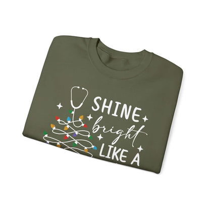 Shine Bright Like a Call Light Christmas Nurse Sweatshirt – Unisex Cozy Stethoscope Tree Crewneck for Healthcare Workers