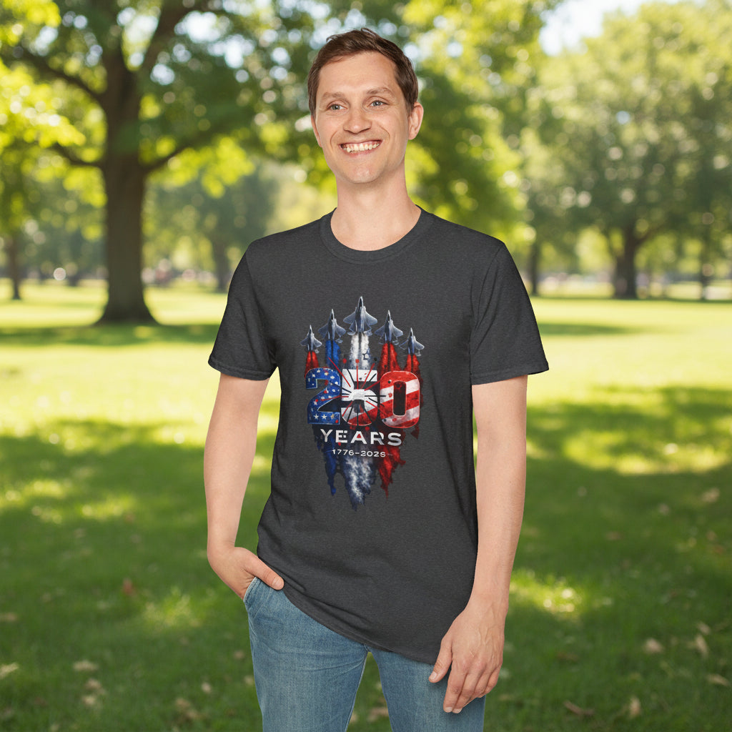 Man wearing a dark gray patriotic graphic t-shirt featuring a distressed American flag design with “250 Years 1776–2025” artwork in a park setting