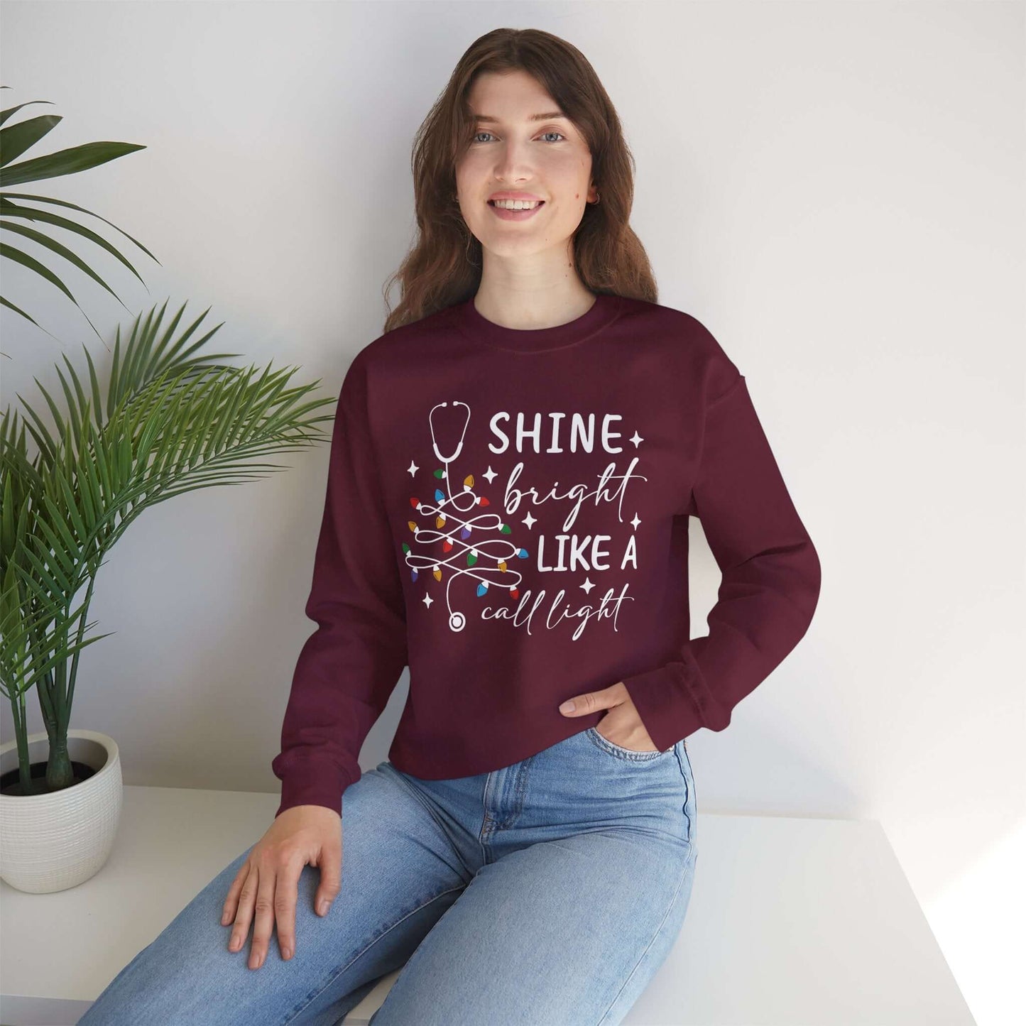 Shine Bright Like a Call Light Christmas Nurse Sweatshirt – Unisex Cozy Stethoscope Tree Crewneck for Healthcare Workers