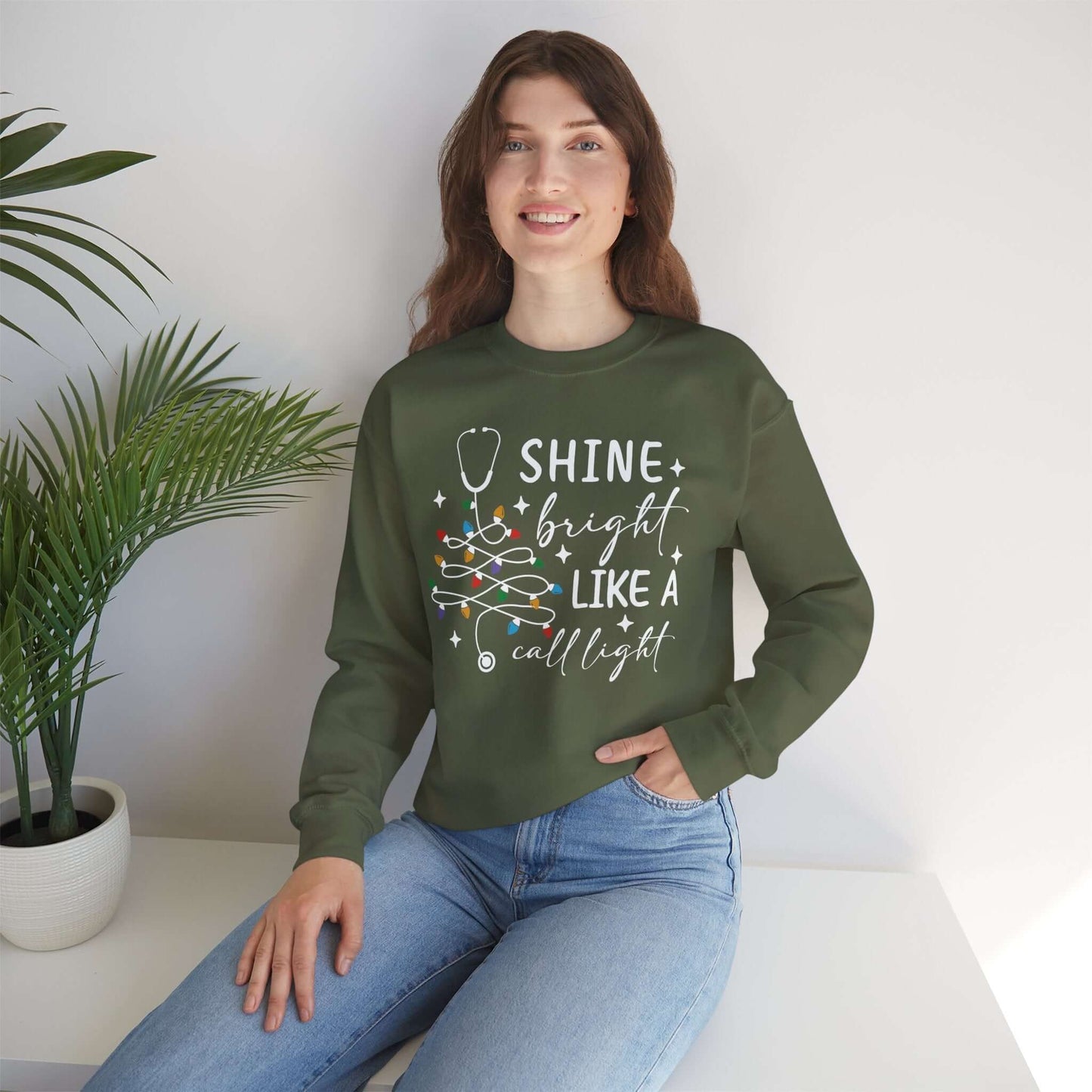 Shine Bright Like a Call Light Christmas Nurse Sweatshirt – Unisex Cozy Stethoscope Tree Crewneck for Healthcare Workers