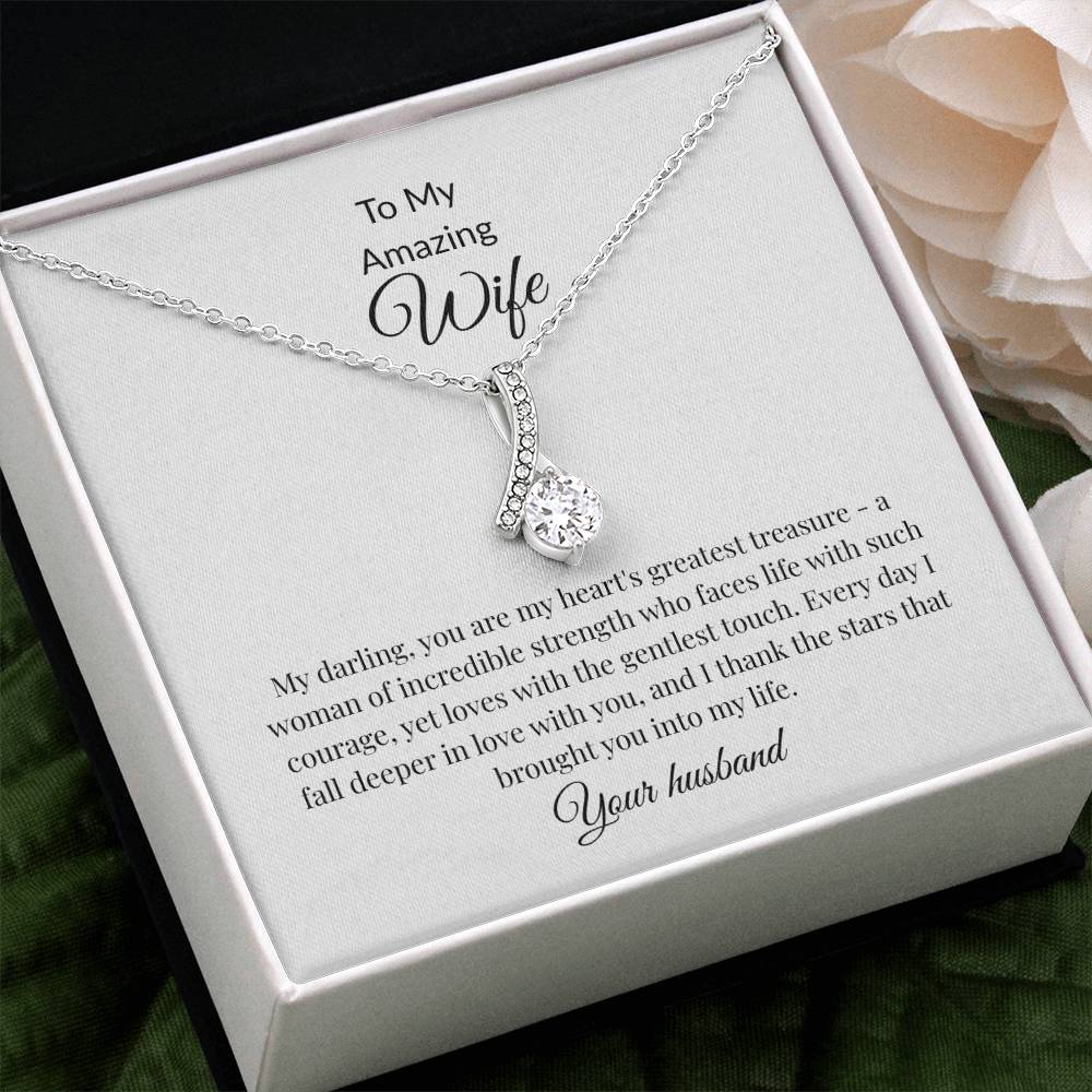 Elegant gold ribbon pendant necklace with sparkling cubic zirconia centerstone, romantic anniversary gift for wife displayed in luxury gift box with LED lighting