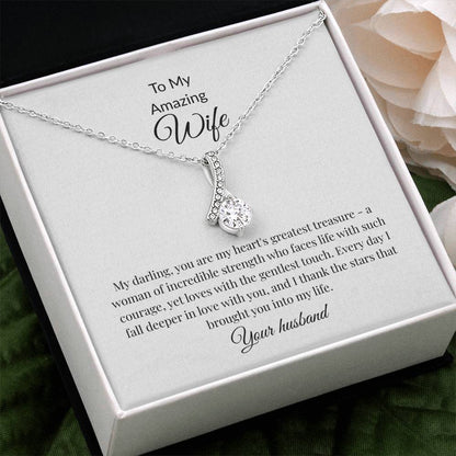 Elegant gold ribbon pendant necklace with sparkling cubic zirconia centerstone, romantic anniversary gift for wife displayed in luxury gift box with LED lighting