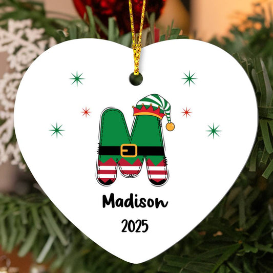 Personalized elf initial heart Christmas ornament with letter M, name Madison, and year 2025 on white background, hanging on Christmas tree.