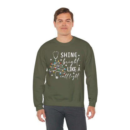 Shine Bright Like a Call Light Christmas Nurse Sweatshirt – Unisex Cozy Stethoscope Tree Crewneck for Healthcare Workers