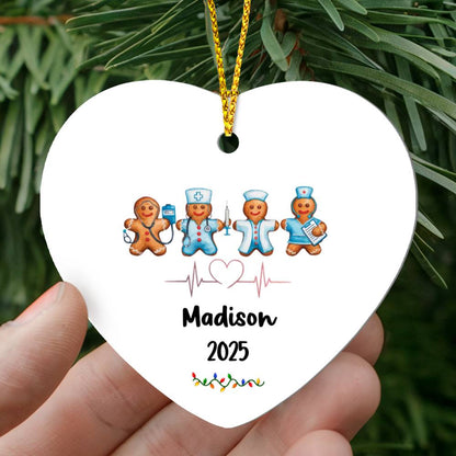 “Personalized nurse gingerbread heart ornament with custom name and year, featuring cute gingerbread medical characters and stethoscope heart design hanging on a Christmas tree.”