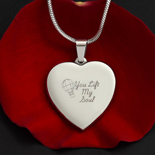 You Lift My Soul engraved heart necklace on polished stainless steel pendant displayed on a red rose with adjustable snake chain, personalized romantic jewelry gift
