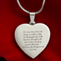 Engraved heart necklace with sentimental message on polished stainless steel pendant displayed on red background, adjustable snake chain, customizable jewelry gift for loved ones.