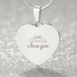 Engraved heart necklace pendant in polished stainless steel with i love you text and hand heart symbol on adjustable snake chain against sparkling silver background
