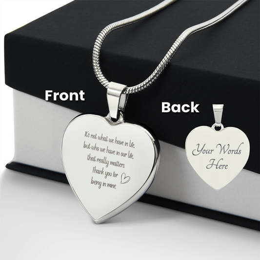 Personalized heart-shaped pendant necklace in polished stainless steel with custom engraving, displayed on snake chain with gift box showing front and back customization options