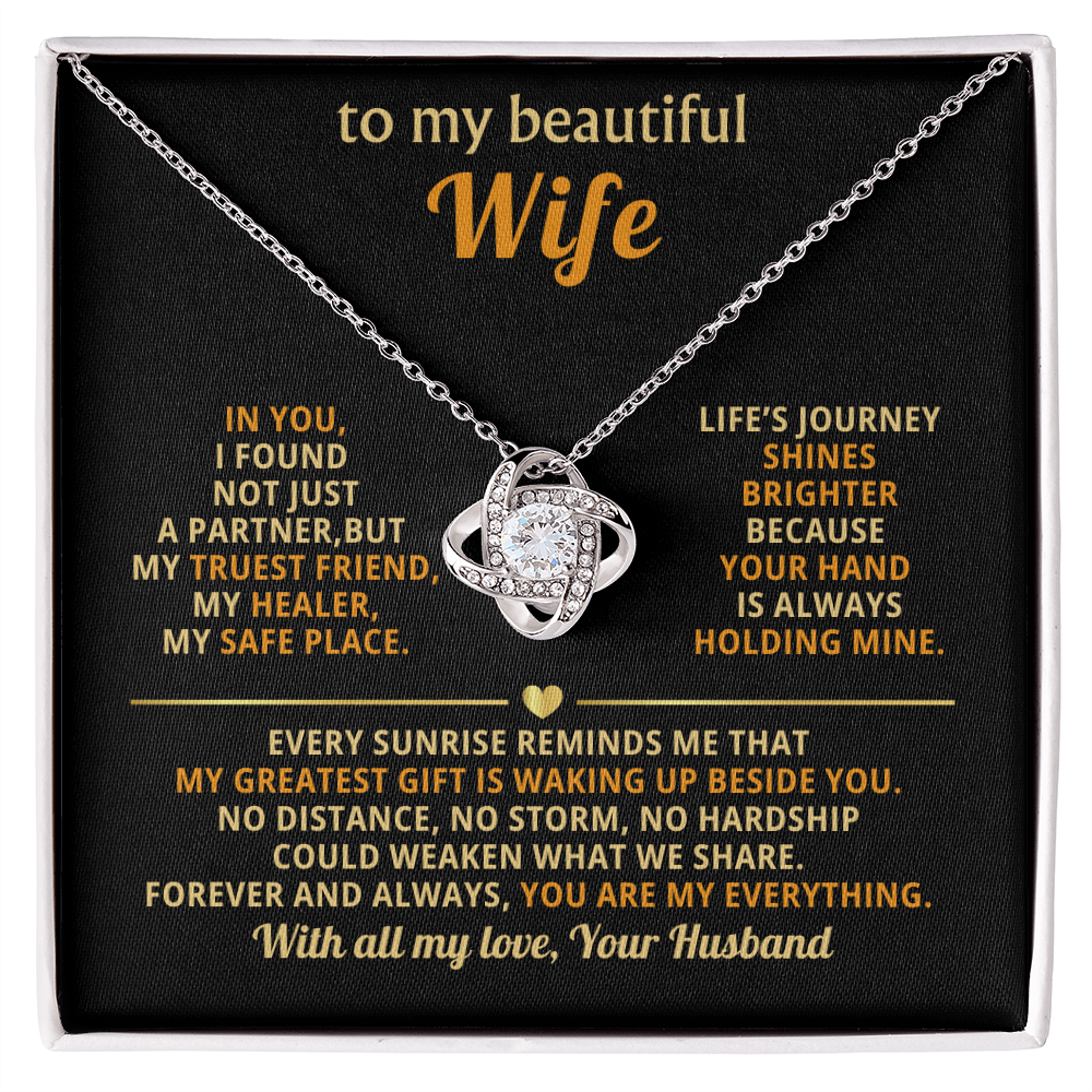 "Elegant love knot necklace with cubic zirconia crystals in premium gold setting - perfect anniversary gift for wife with romantic message card"