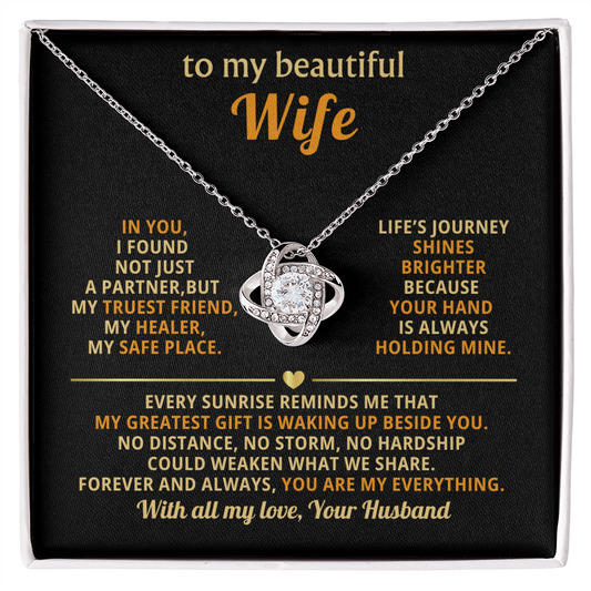"Elegant love knot necklace with cubic zirconia crystals in premium gold setting - perfect anniversary gift for wife with romantic message card"