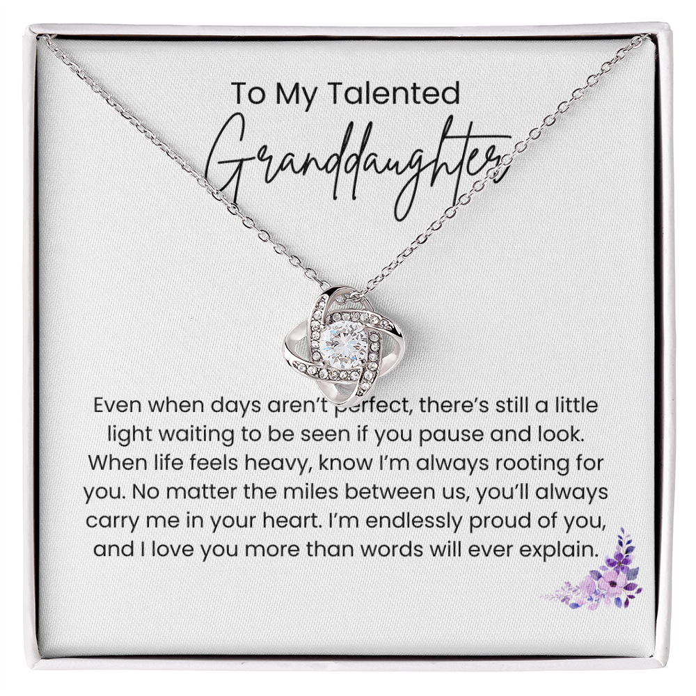 Love Knot Necklace for granddaughter displayed on inspirational message card with cubic zirconia pendant and adjustable chain.
