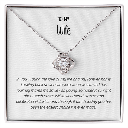 Love Knot necklace with interlocking design and sparkling CZ crystals in white gift box labeled "To My Wife" with romantic message about eternal love and unbreakable bond - Perfect anniversary gift