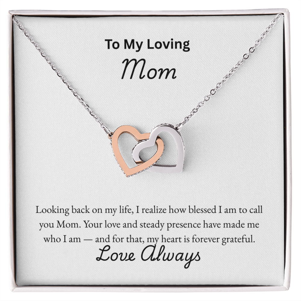 Interlocking Hearts Necklace for Mom with CZ crystal pendants in rose gold and silver finish, displayed in a white gift box with sentimental "To My Loving Mom" message card — perfect Mother's Day or birthday jewelry gift.