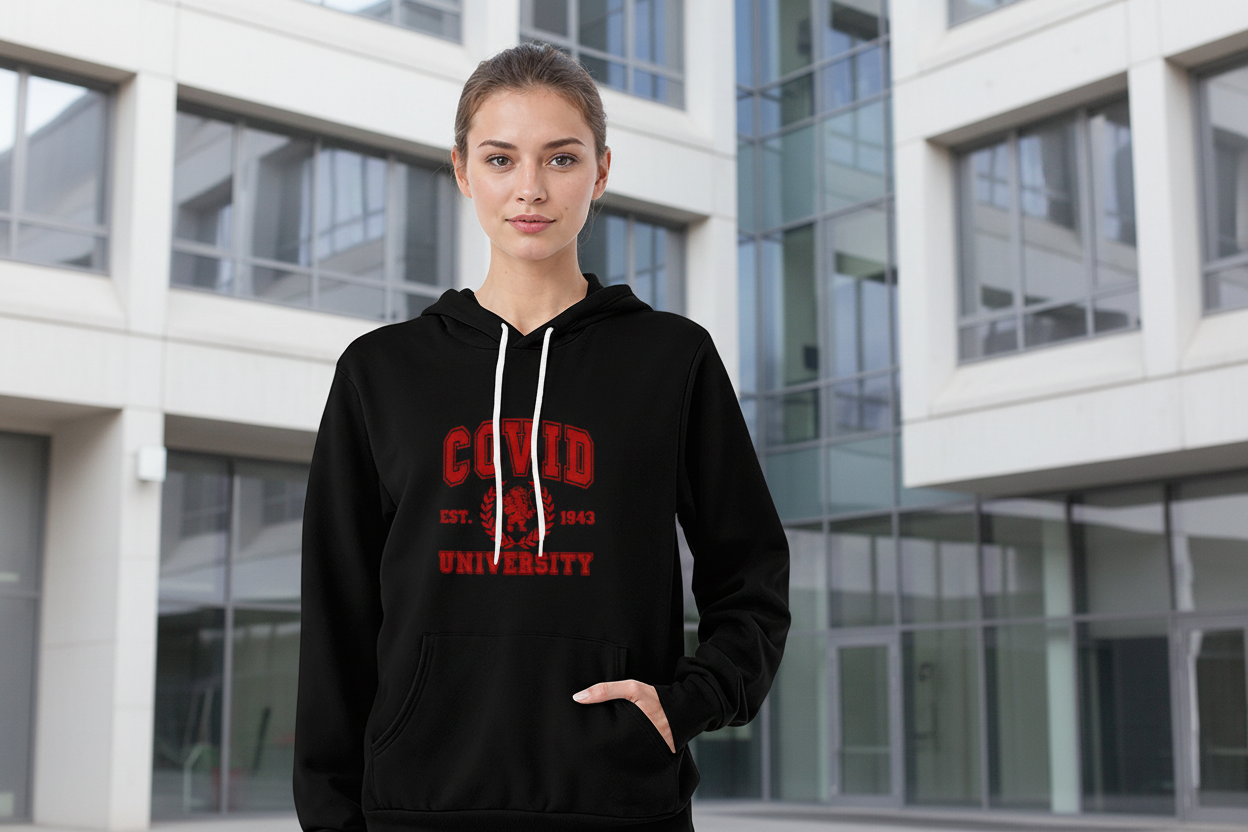 Black Bella Canvas 3719 pullover fleece hoodie featuring red "Cupid University EST. 1823" graphic with lion emblem, white drawstring, kangaroo pocket, modeled by woman in light blue jeans on white background