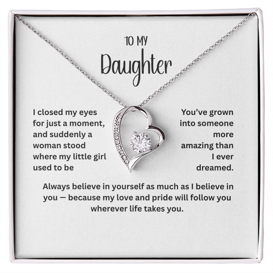 “To My Daughter heart pendant necklace with sparkling cubic zirconia stone and heartfelt message card in gift box – available in 14k white gold or 18k yellow gold finish.”