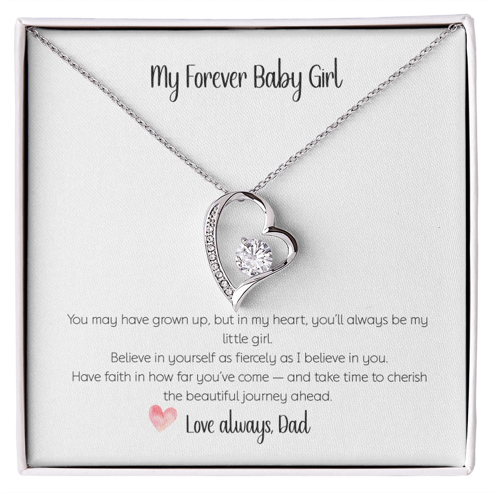 Forever Love heart-shaped necklace with sparkling CZ crystal center stone and diamond accents on white gold chain, displayed in gift box with "My Forever Baby Girl" card from dad to daughter