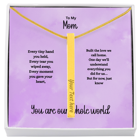 Personalized 4-sided engraved stick necklace in gold with custom text on each side displayed in gift box with sentimental message card for mom