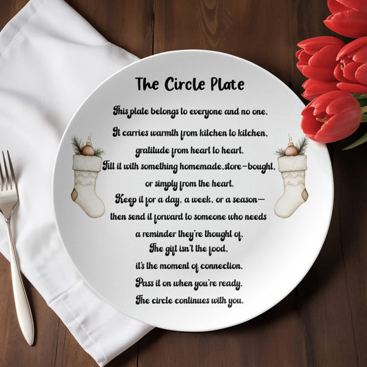 “The Circle Plate with heartfelt message about sharing gratitude and connection, featuring festive stockings design, displayed on a wooden table with red tulips.”