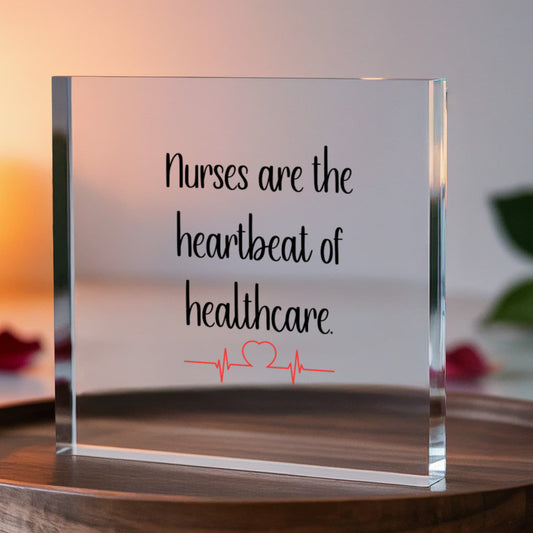 Clear acrylic block displaying inspirational nurse quote "Nurses are the heartbeat of healthcare" with red EKG heartbeat line design, 6x6 inch premium nurse appreciation gift for desk or home display