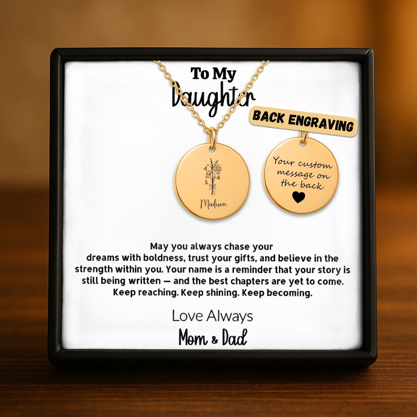 Personalized gold disc necklace for daughter in a black gift box, featuring a custom name and birth flower engraving on the front and a laser-engraved message on the back, from Mom and Dad — available in 18k gold, rose gold, and stainless steel.