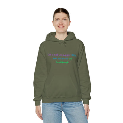 Faith Quote Hoodie – "God Is Still Writing Your Story" Unisex Heavy Blend Christian Sweatshirt