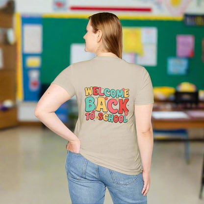 Person wearing a beige t-shirt with 'Welcome Back to School' text in colorful letters on a white background